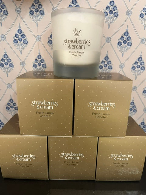 
Candle - Linen - Strawberries & Cream - Ingrid Lewis  Candle and packaging with 'Strawberries & Cream' branding on a patterned surface