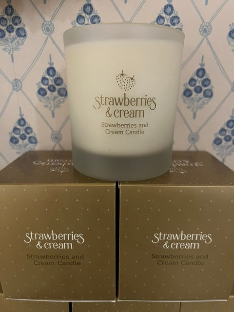 Candle - Strawberries & Cream candle -Strawberries and Cream -  Ingrid Lewis 

Candle and packaging with 'Strawberries & Cream' branding on a patterned surface