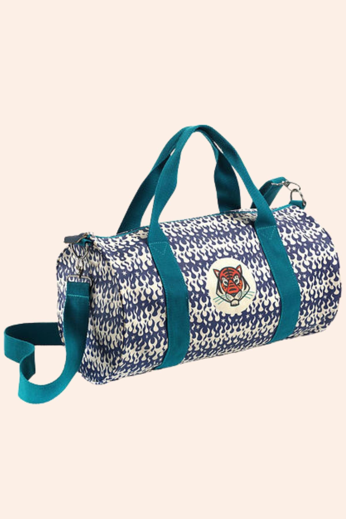 Djeco - Duffel Bag - Bengal Tiger - Strawberries & Cream - Ingrid_Lewis_-_Designer
Duffle bag with blue and white pattern and a logo.