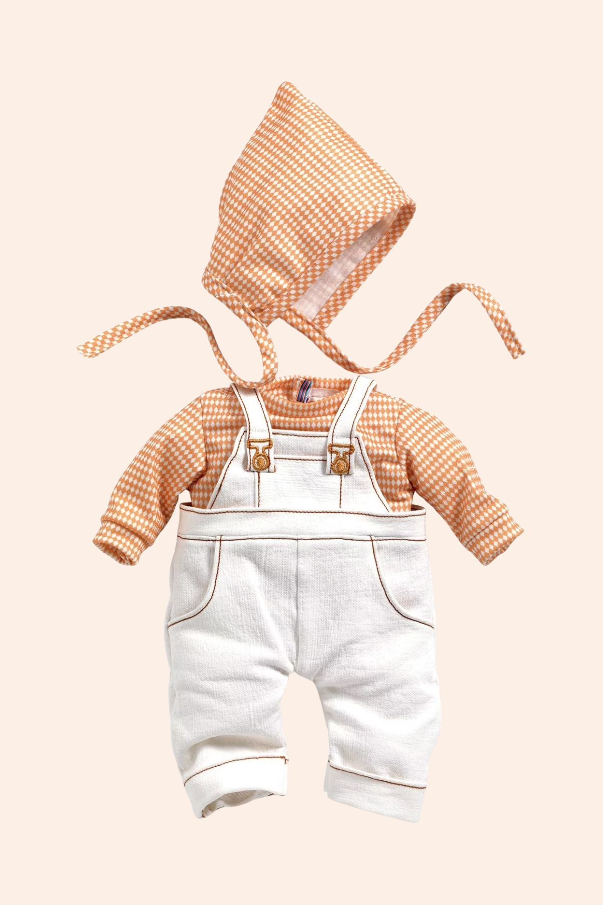 Djeco - Pomea - Cannelle Outfit  - Strawberries & Cream 
Baby doll wearing a checkered shirt, white overalls, and a matching hat.