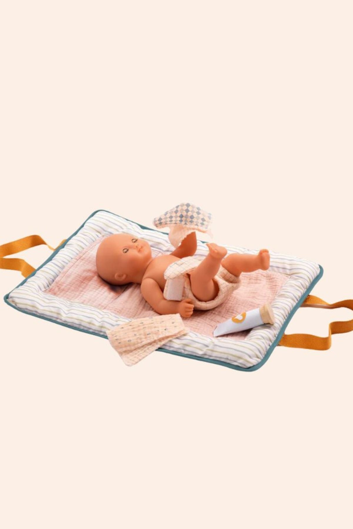 Djeco - Pomea - Changing Bag Blue Fly 
Baby doll on a soft changing bag flattened blanket with ribbon handles.