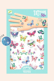 Butterfly-themed temporary tattoos with a hand model on a blue packaging background