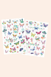 Two sheets of colorful butterfly and flower stickers on a beige background