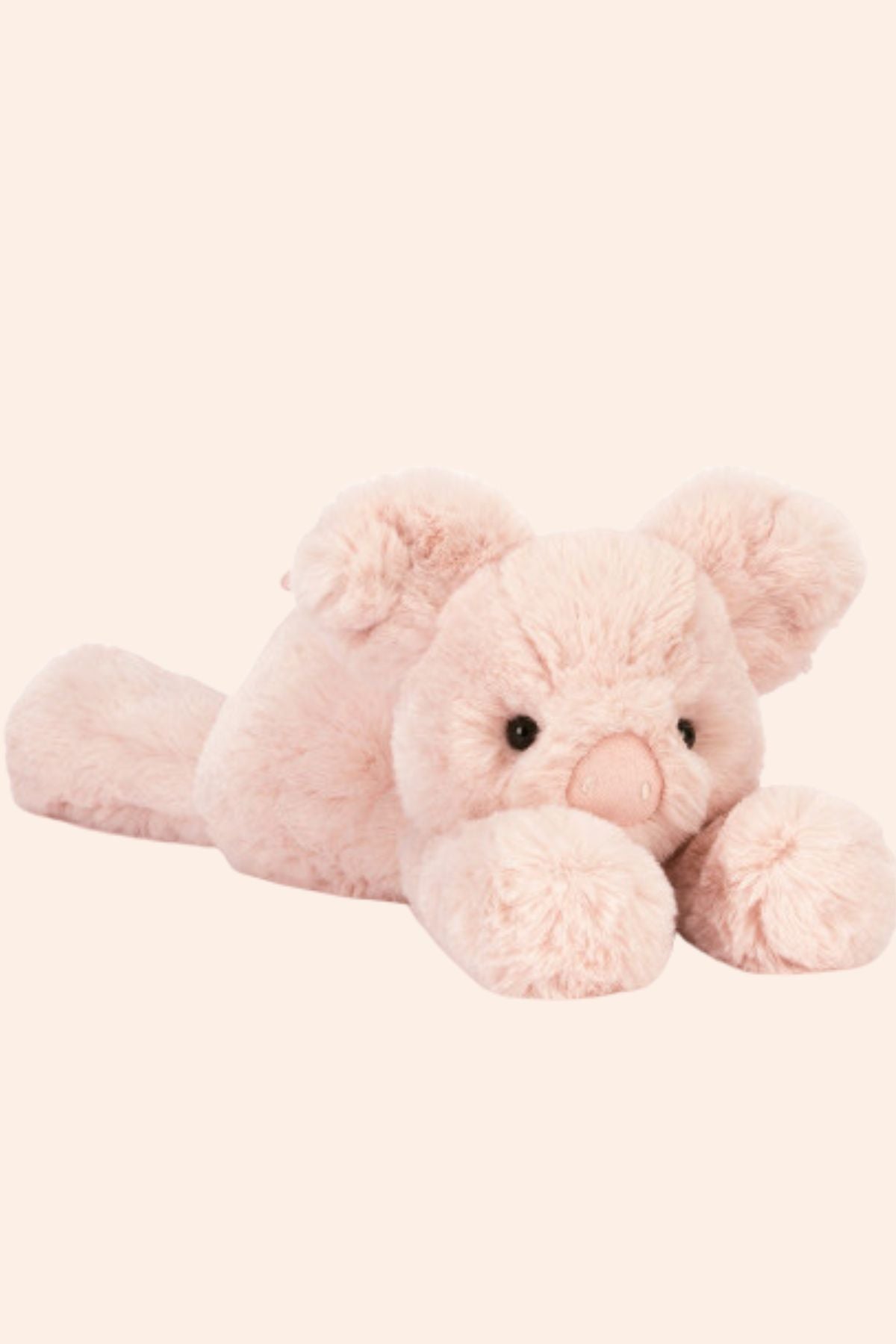 Pink plush elephant toy on a white background