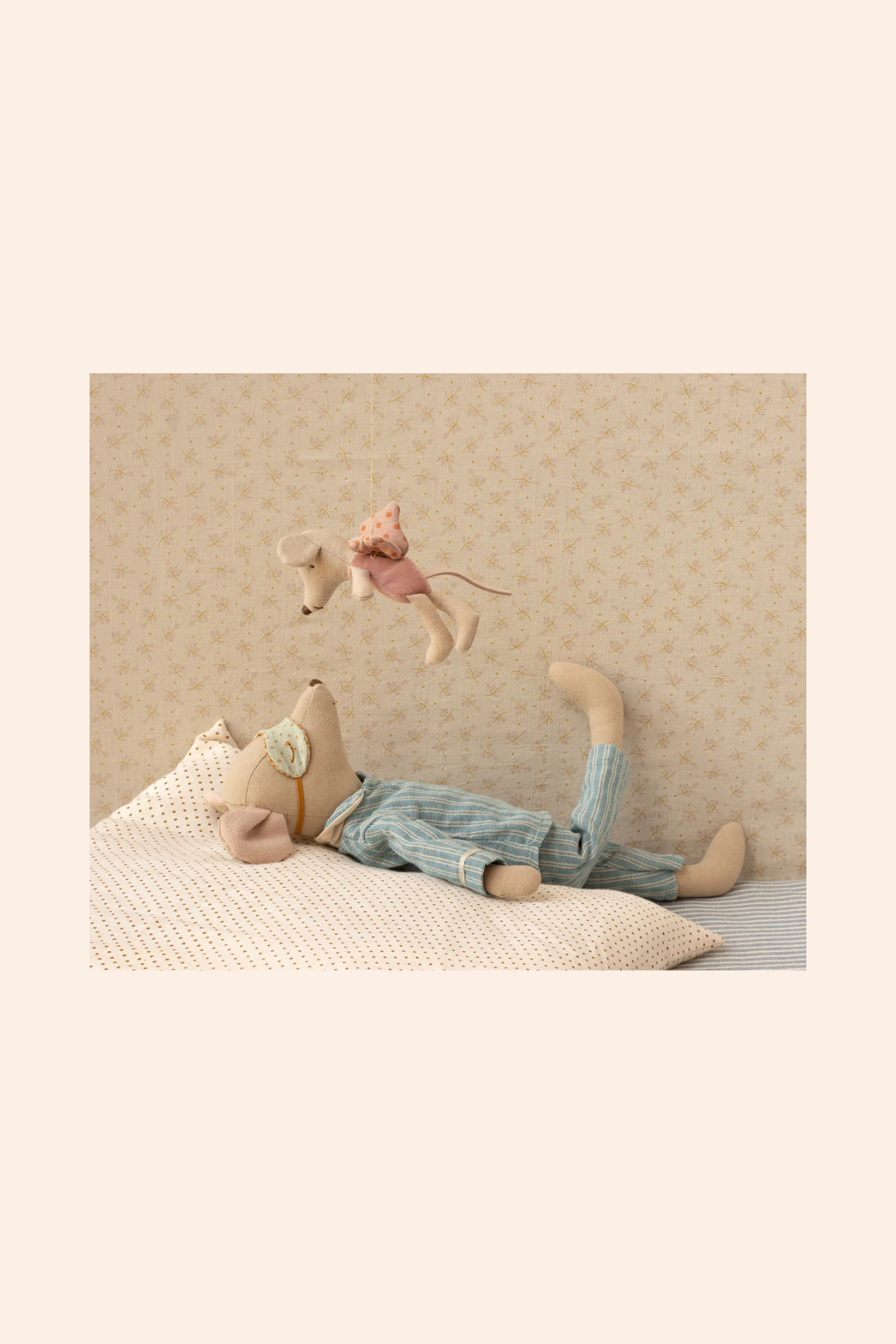 Three stuffed animals on a textured surface with a neutral background
