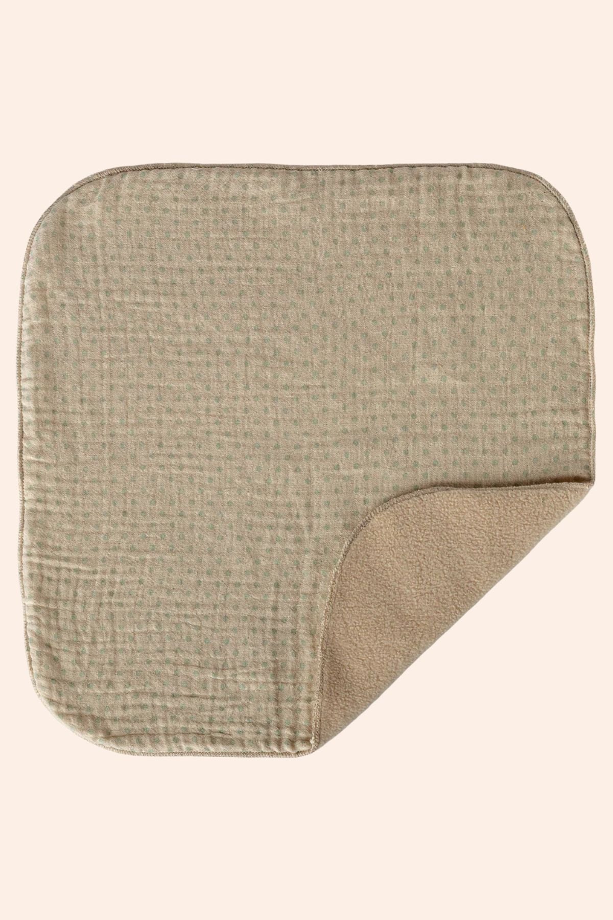 Square mat with textured surface on a beige background