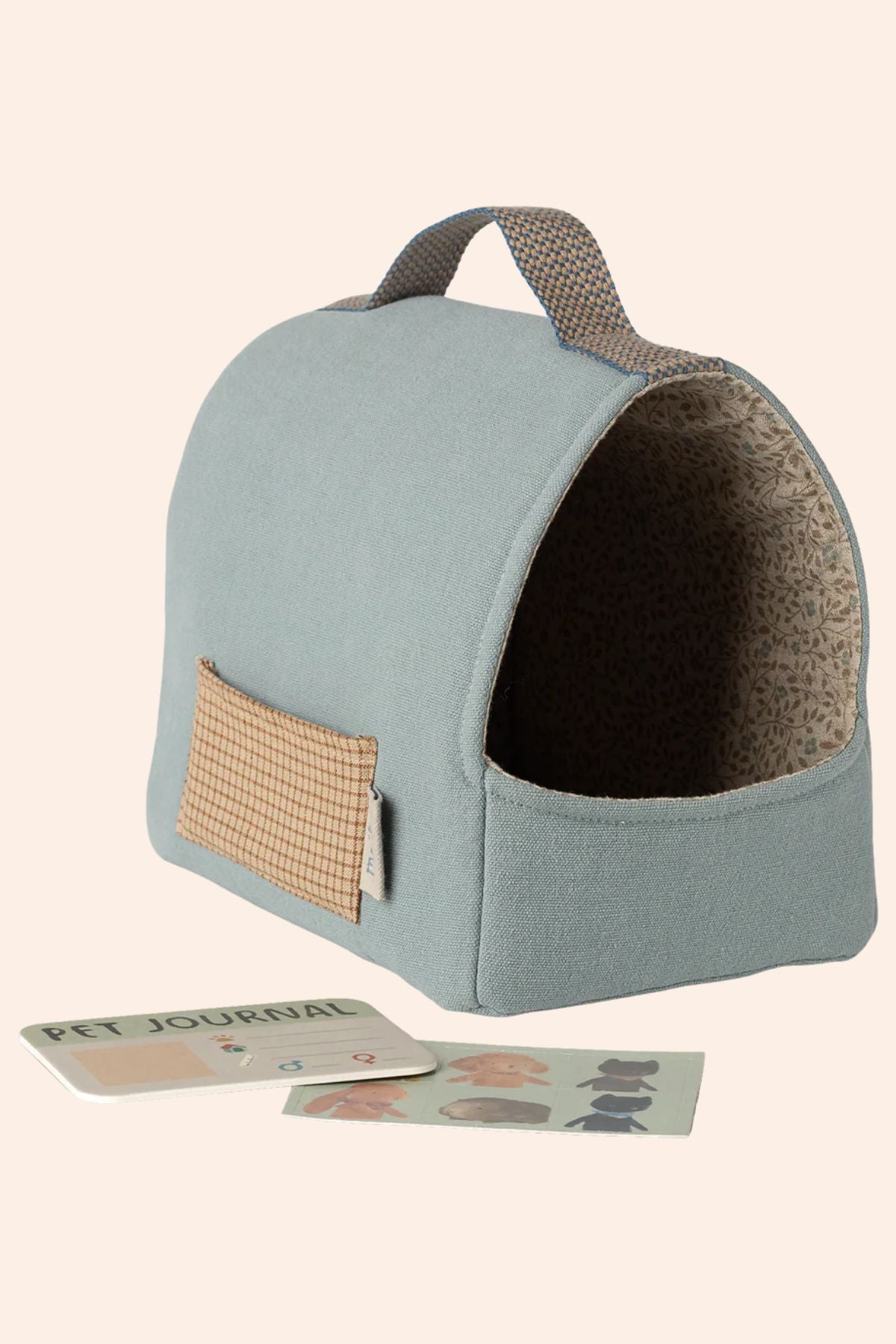 Pet bed with a small pouch on a beige background