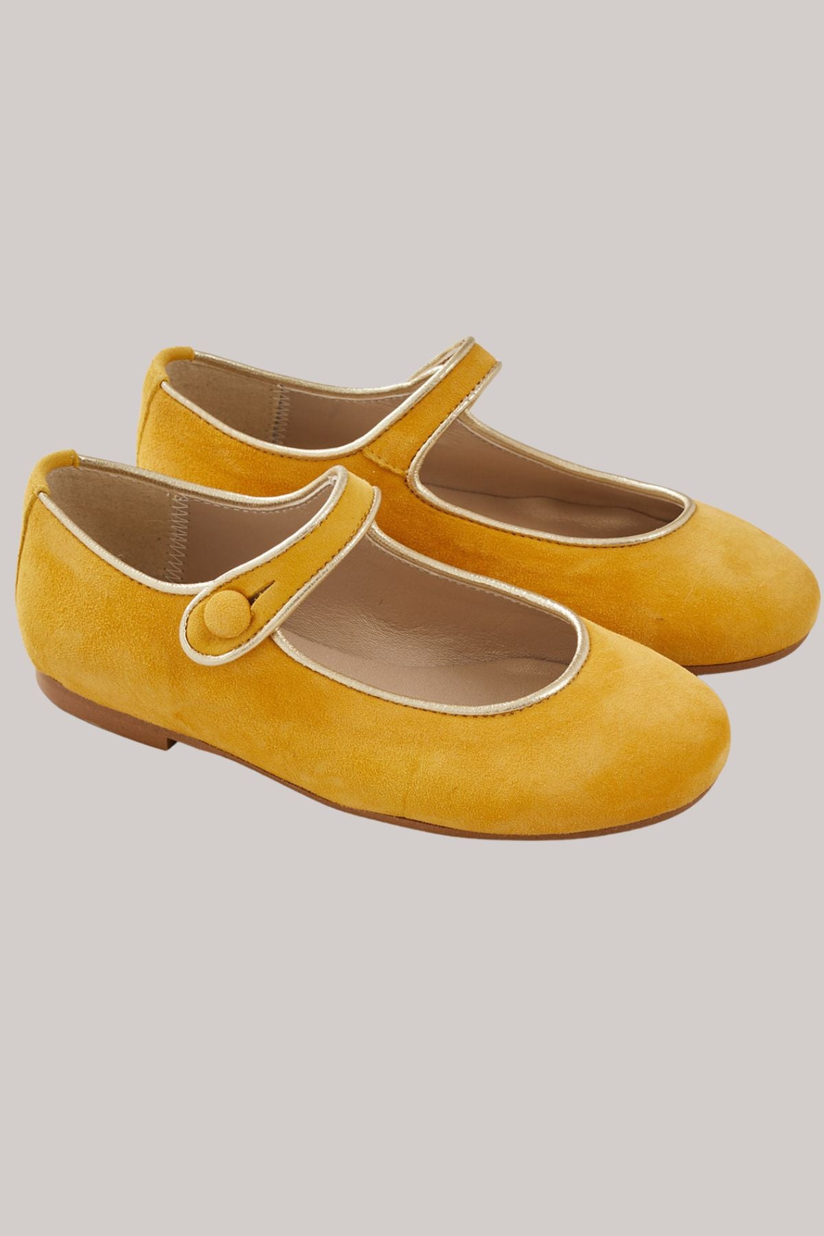 Mary Jane - Suede Mustard - Strawberries & Cream - Ingrid Lewis - Designer 
Pair of mustard yellow shoes with a button detail.