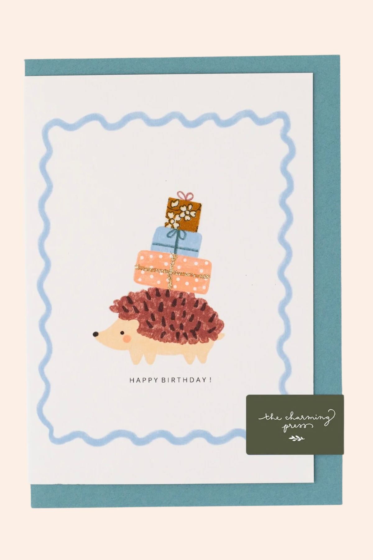 Birthday card with a hedgehog carrying presents and 'Happy Birthday!' text, framed by a blue border.