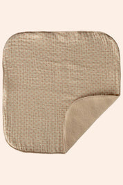 Beige textured square mat on a white background