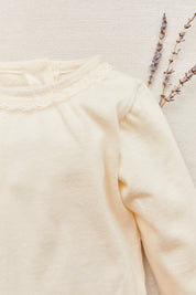 Cream sponge body with lace trim, jersey/T shirt