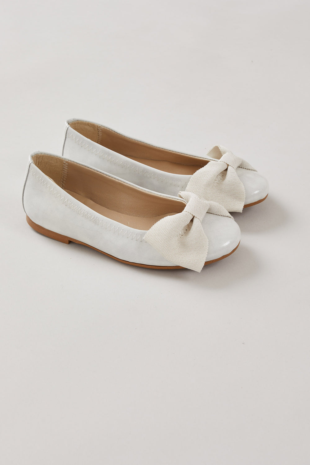Patent Leather Ballerina Bow In Midnight White